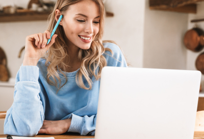 Woman working on a laptop computer, representing the dental care centers new website
