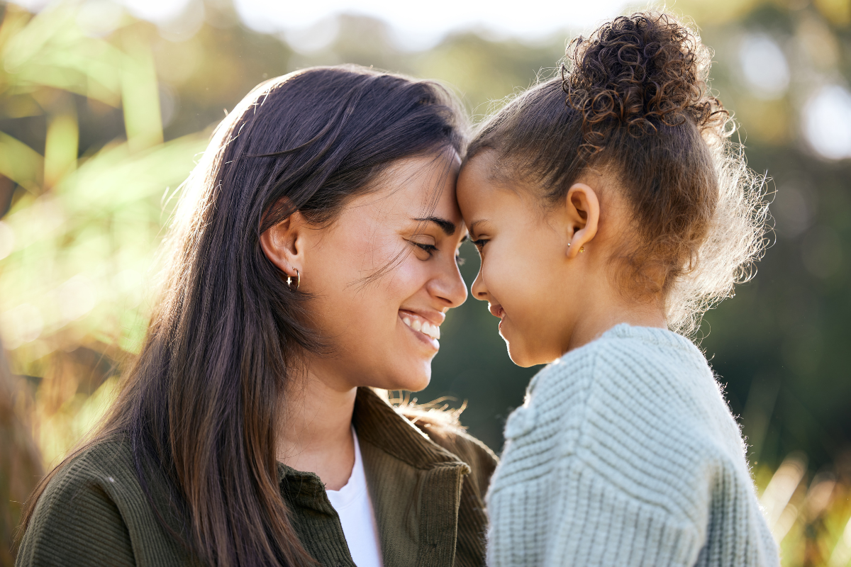 Expert-dental-care-near-elm-city Young mother and daughter enjoying time together, symbolizing joy and the benefits of comprehensive dental care including same-day dentures, restorative and cosmetic dentistry at our elm city center.