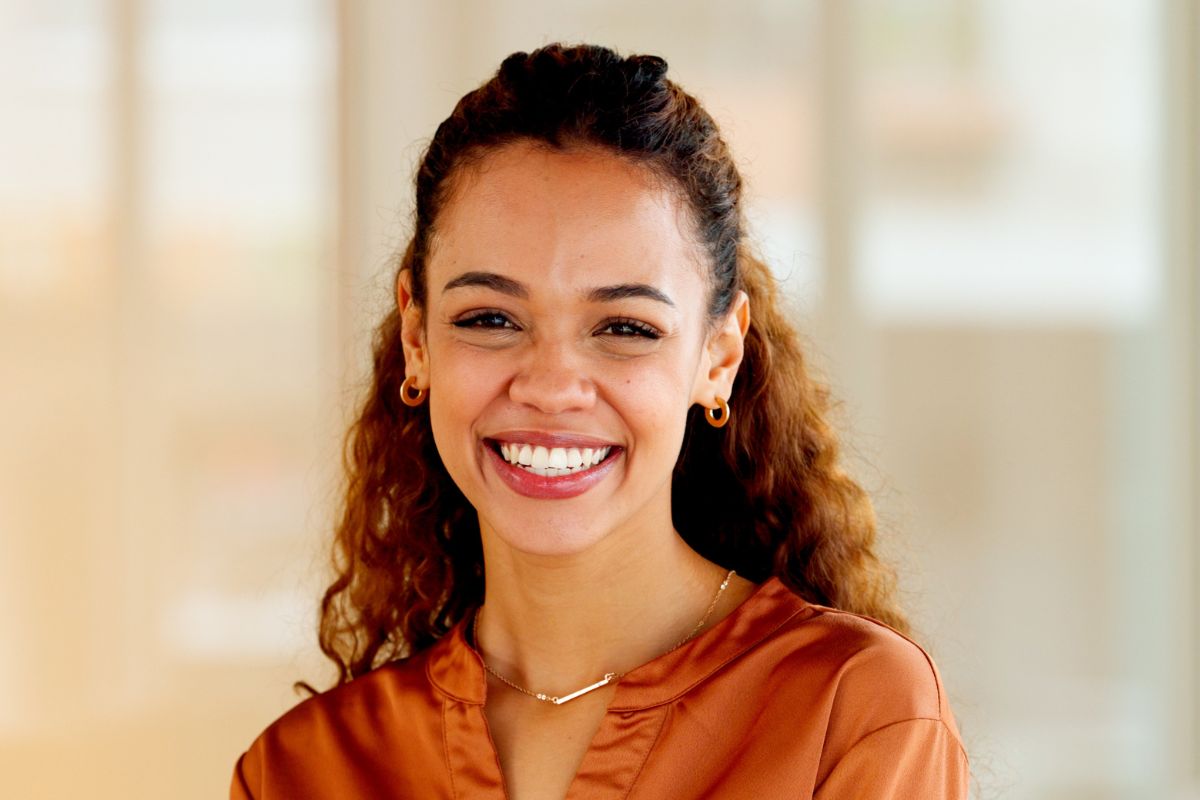 Expert-dental-checkups-north-carolina Latino business woman smiling joyfully in an office