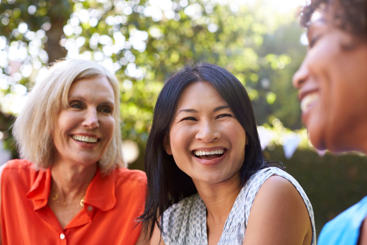 Expert-dental-implant-treatment-eastern-north-carolina Smiling dental implant patient at the dental care center serving zebulon, wake forest, fayetteville, greenville, smithfield, and wilson, north carolina.