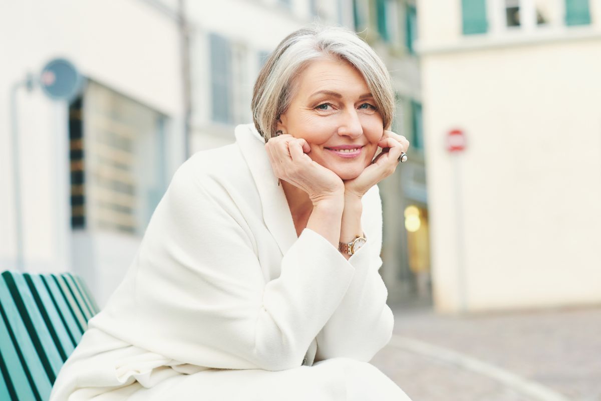 Expert-full-mouth-restorations-eastern-north-carolina Woman smiling confidently after full-mouth restoration treatment.