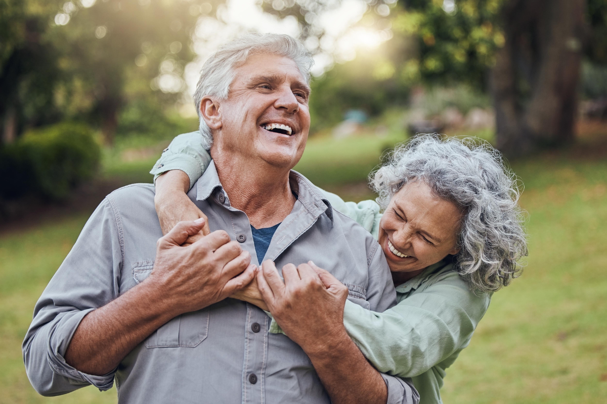 Expert-gum-disease-therapy-eastern-north-carolina Smiling couple after gum disease therapy at the dental care center serving zebulon, wake forest, fayetteville, greenville, smithfield, and wilson, north carolina.