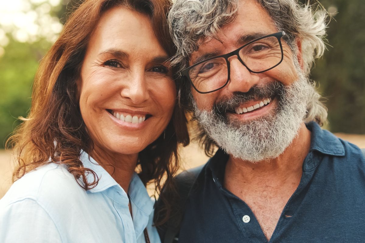 Smiling patients after oral surgery at the dental care center serving zebulon, wake forest, fayetteville, greenville, smithfield, and wilson, north carolina.
