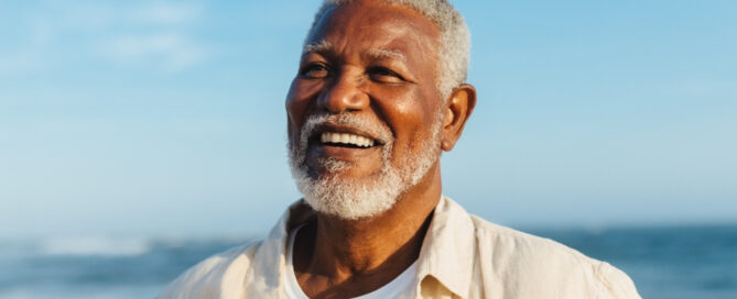 Placeholder 3 3 Happy senior patient smiling confidently after restorative dentistry treatment.