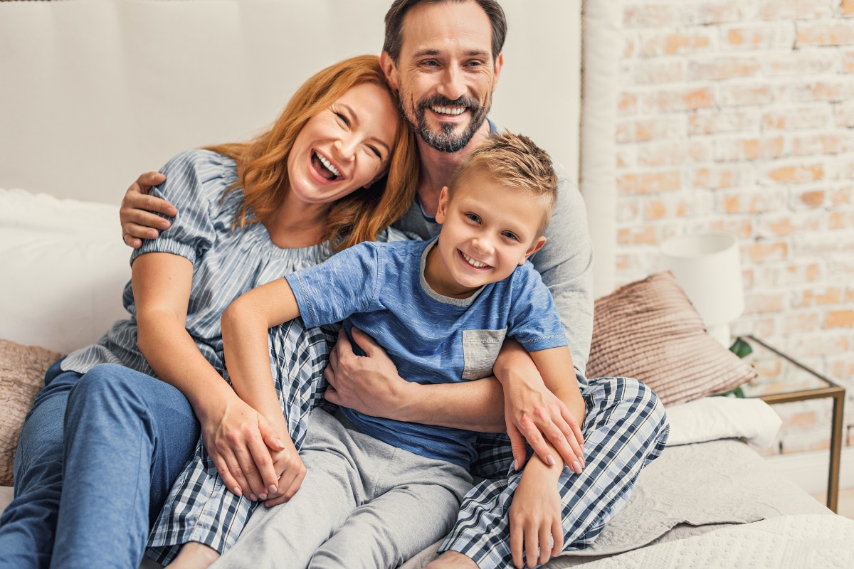 The-dental-care-center-services-why-choose Happy family smiling together after visiting the dental care center in eastern north carolina