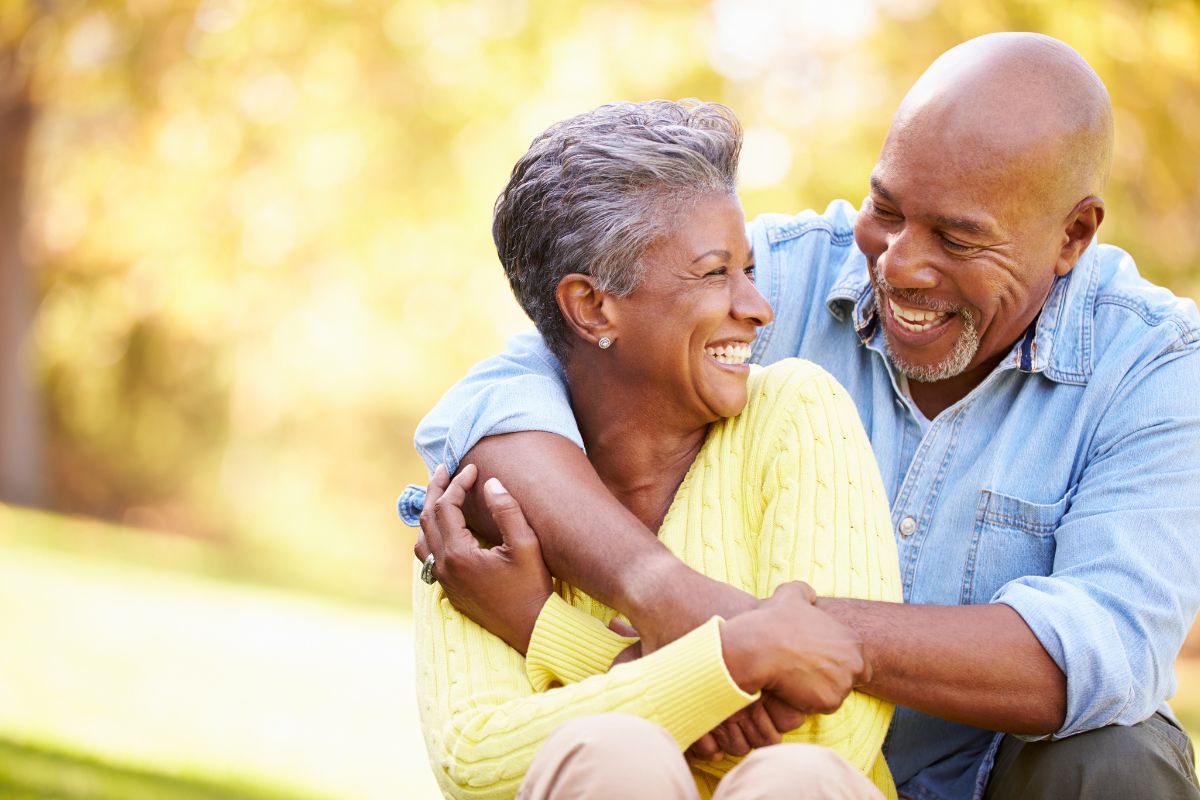 Top-rated-cosmetic-dental-bonding-eastern-north-carolina Smiling couple enjoying life after cosmetic dental bonding treatment.