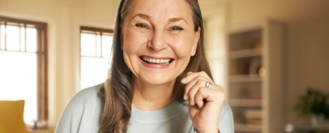 Placeholder 1 5 Happy senior woman smiling indoors with custom replacement dentures in north carolina