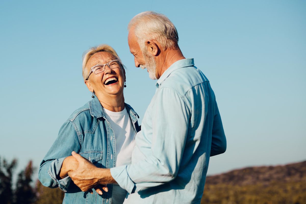 Top-rated-partial-denture-treatment-eastern-north-carolina Smiling couple enjoying life with partial dentures from the dental care center serving zebulon, wake forest, fayetteville, greenville, smithfield, and wilson, north carolina.