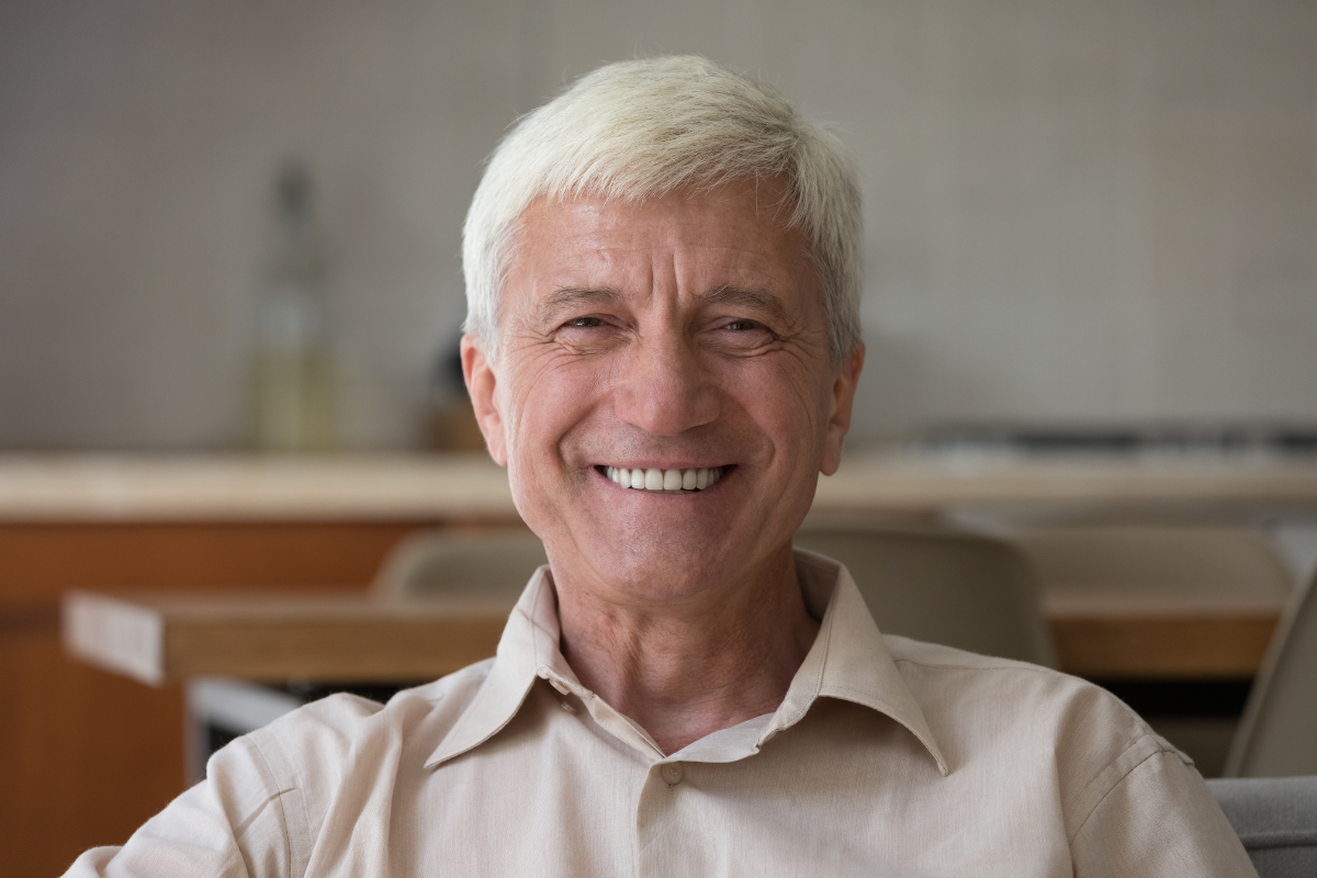 Top-rated-post-extraction-dentures-eastern-north-carolina Patient after same-day post-extraction denture treatment at the dental care center serving zebulon, wake forest, fayetteville, greenville, smithfield, and wilson, north carolina.