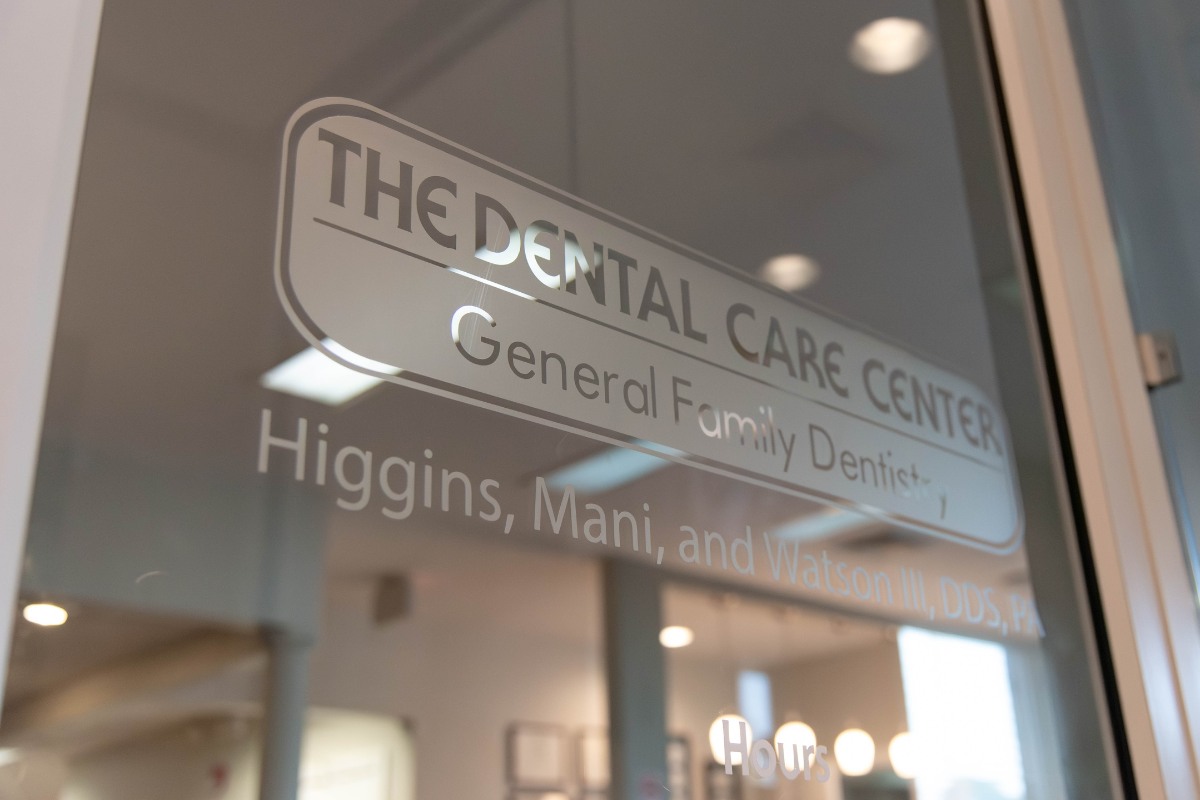 The-dental-care-center-fayetteville-office-door-glass The dental care center fayetteville nc office signage on glass door for general family dentistry practice
