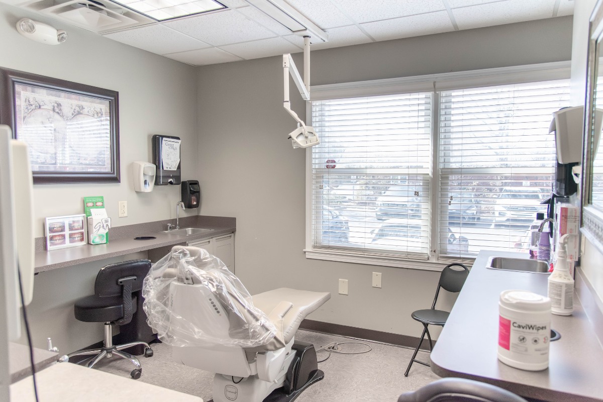 The-dental-care-center-fayetteville-office-exam-room-2 Dental exam room in fayetteville nc with patient chair and modern equipment for general dentistry care