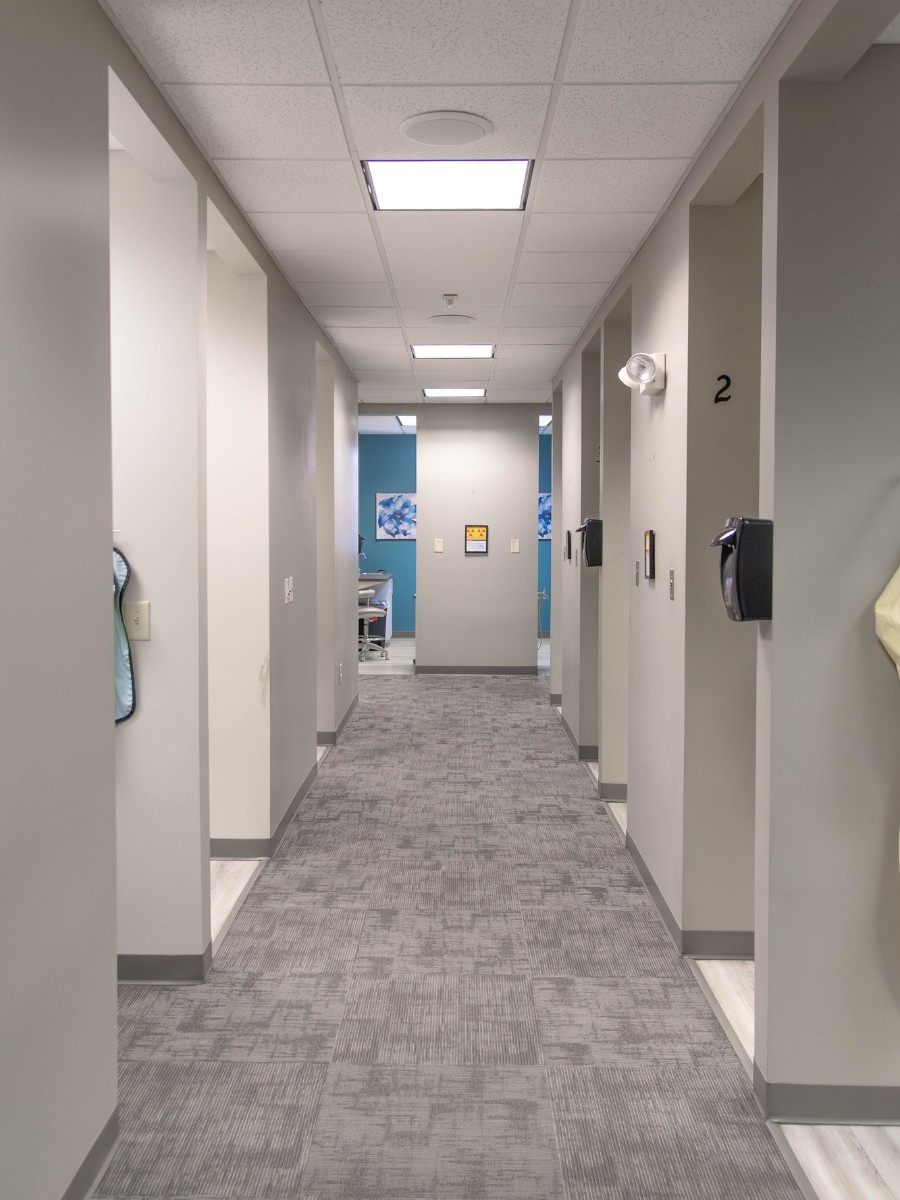 The-dental-care-center-smithfield-office-hallway Dental office hallway in smithfield nc with modern treatment rooms for general family dentistry
