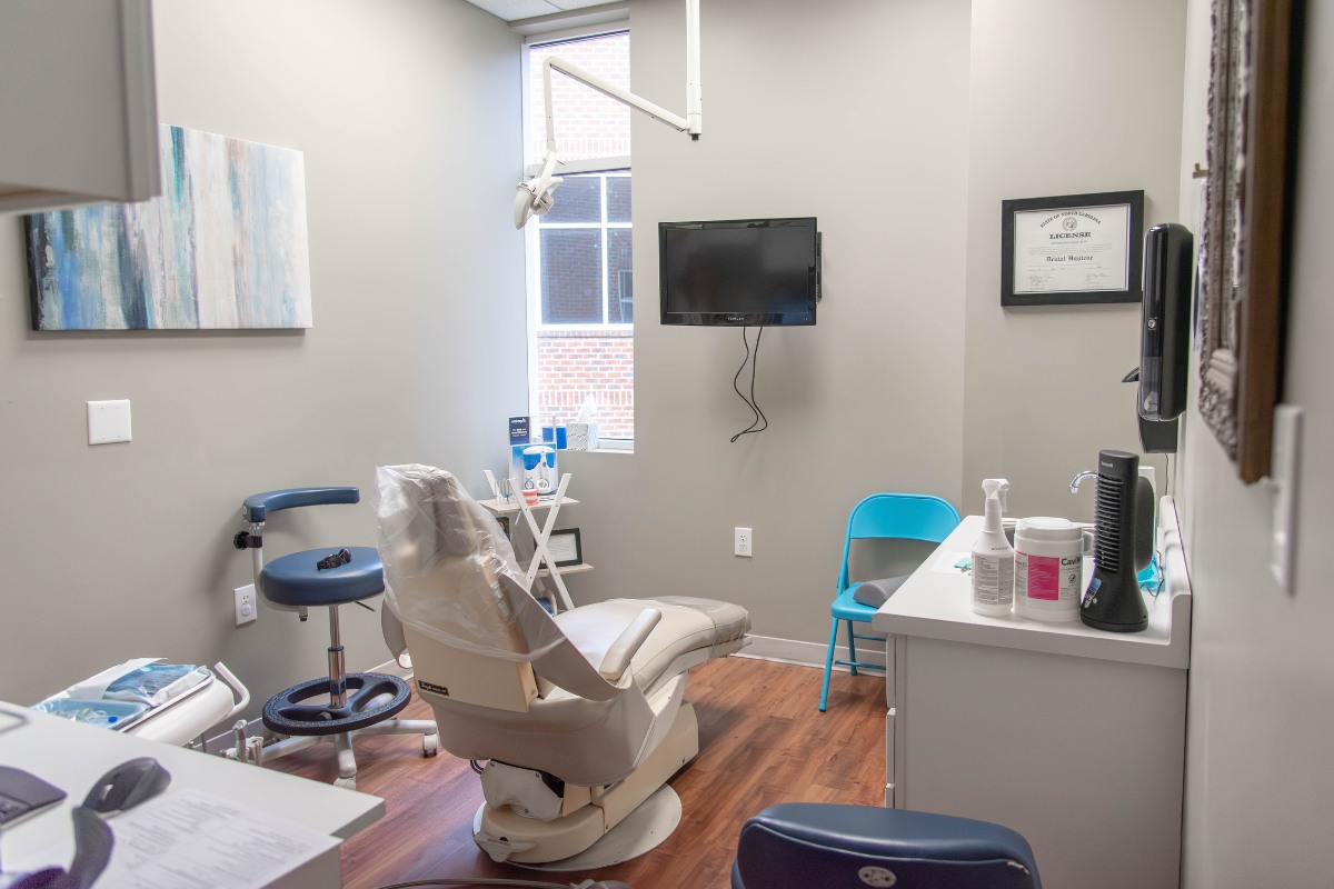 The-dental-care-center-wake-forest-office-exam-room-1 Dental exam room in wake forest nc with modern equipment for general and preventive dentistry