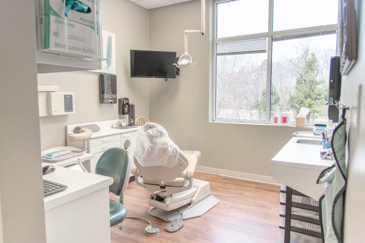 The-dental-care-center-wake-forest-office-exam-room-2 Dental treatment room in wake forest nc with natural light and advanced dental equipment