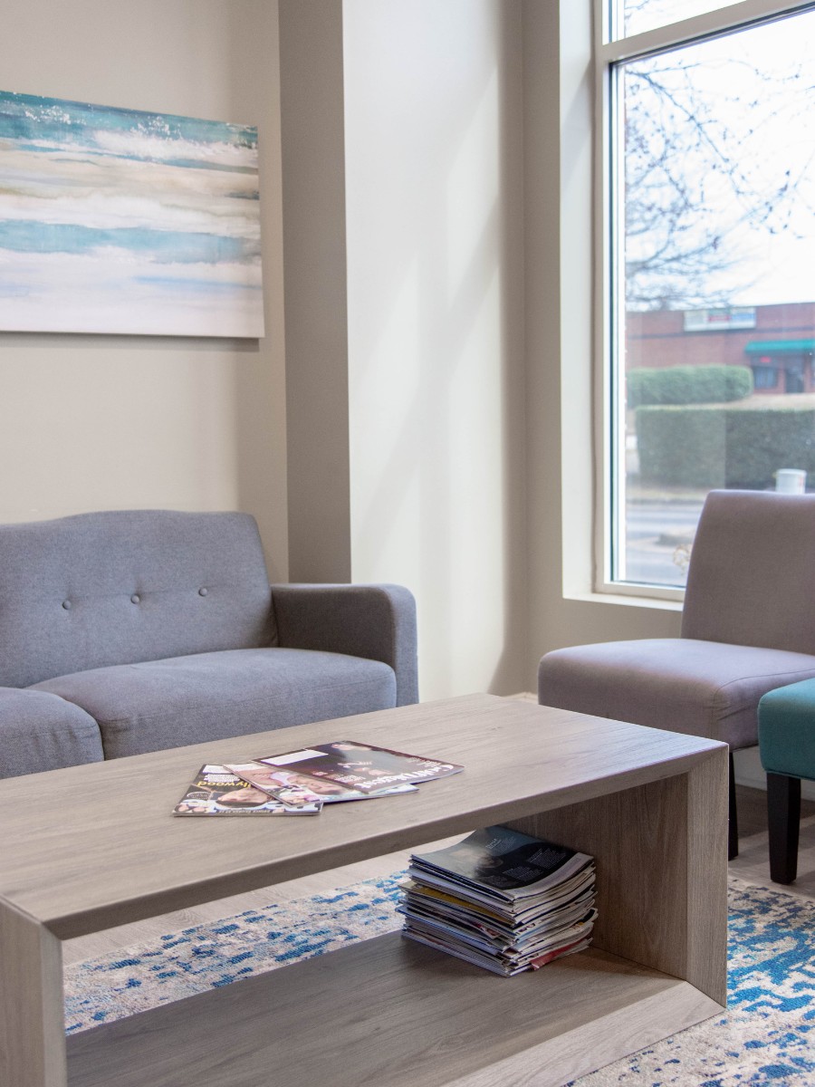The-dental-care-center-wake-forest-office-lobby Dental waiting area in wake forest nc with coffee table and seating for patients