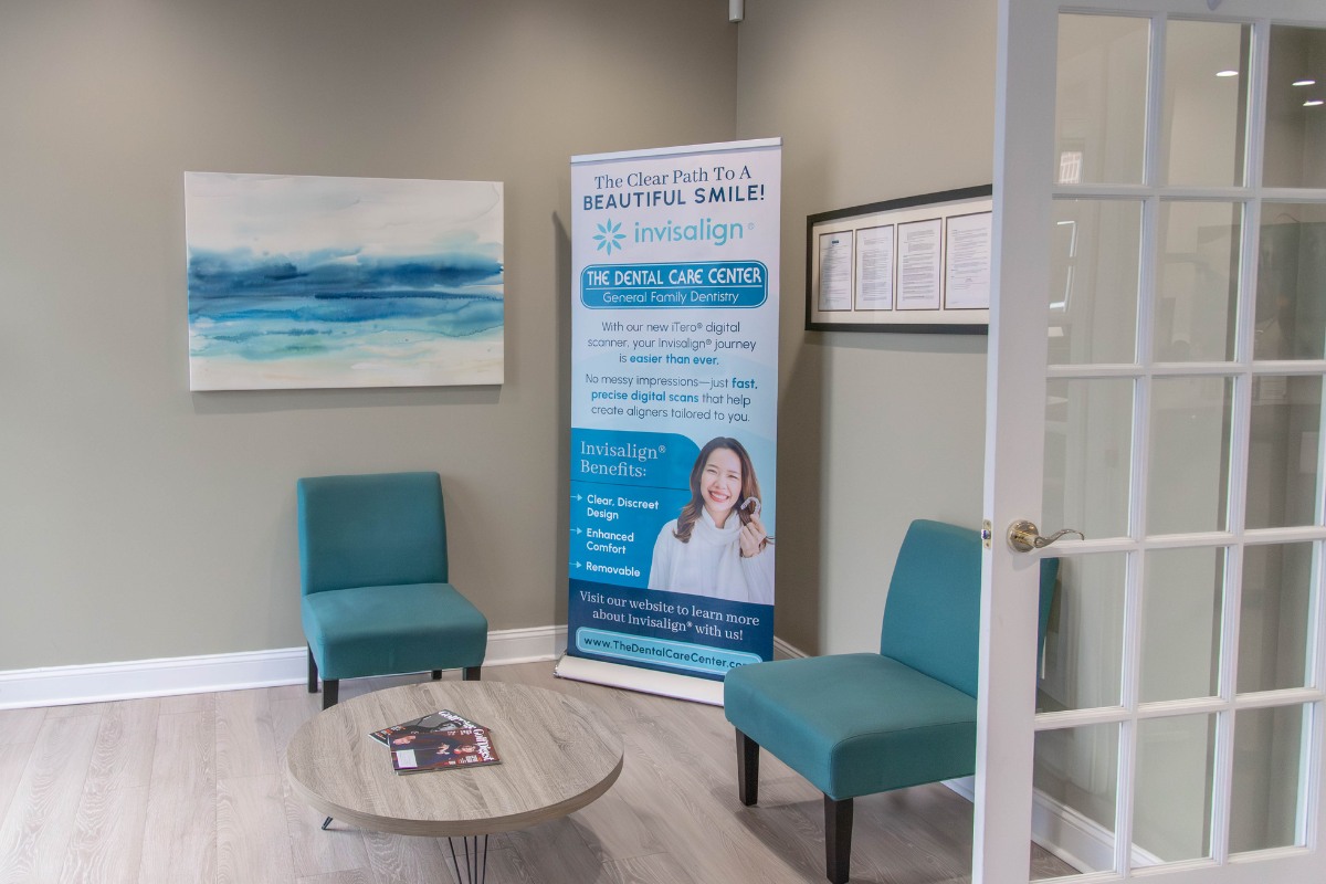 The-dental-care-center-wake-forest-office-waiting-area Dental waiting area in wake forest nc with invisalign banner and seating for orthodontic consultations