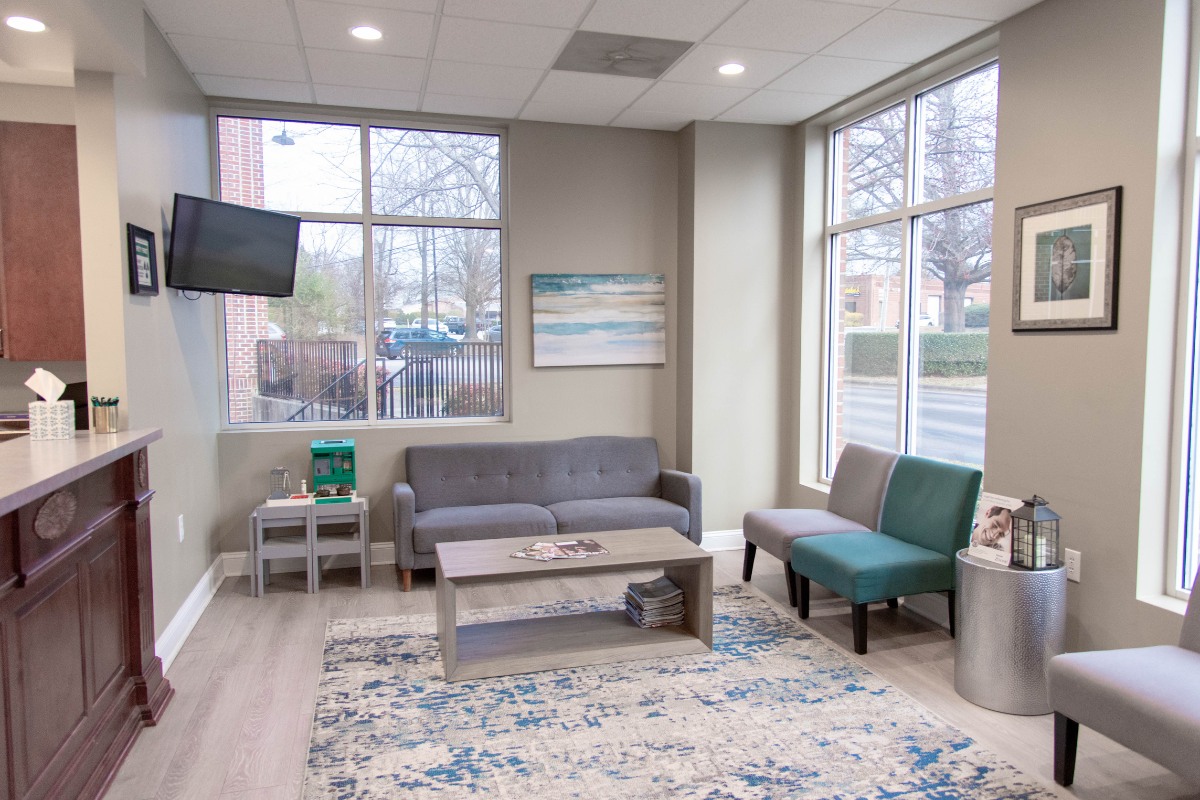 The-dental-care-center-wake-forest-office-waiting-room Dental office waiting room in wake forest nc with comfortable seating and large windows