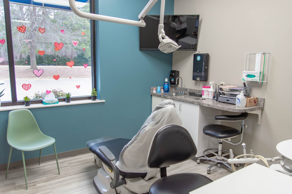 The-dental-care-center-wilson-office-exam-room-2 Dental exam room in wilson nc with modern equipment and patient chair for general dentistry