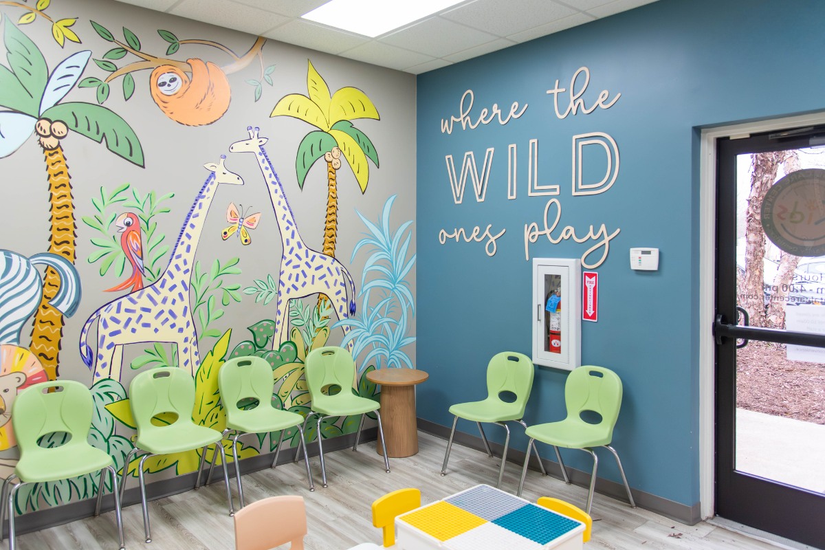 The-dental-care-center-wilson-office-waiting-area Kids dental waiting area in wilson nc with colorful mural and seating for pediatric dentistry patients